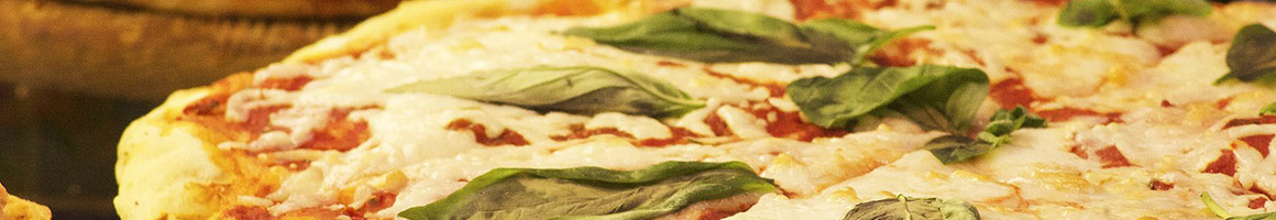 Eating Italian Pizza at Avicolli’s Pizza restaurant in Seneca Falls, NY.